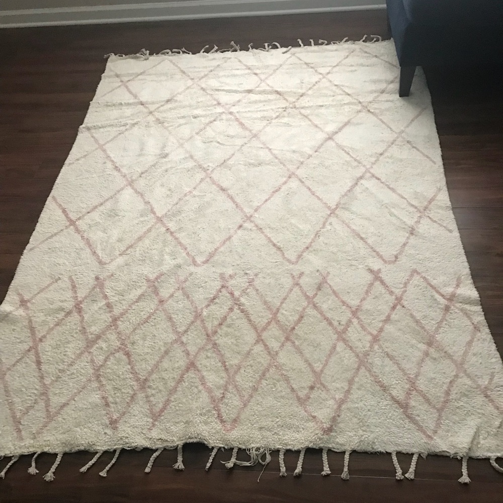 Area rug a little over 5’x7’.
